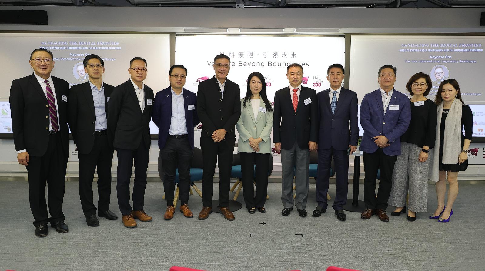 Ms Cari Wu, Acting Assistant Government Chief Information Officer (Industry Development) (middle), joined Mr Emil Chan, Chairman of Hong Kong Digital Finance Association (5th left), Prof Houmin Yan, Director of Laboratory for AI-Powered Financial Technologies and Chair Professor of Management Sciences at City University of Hong Kong (5th right), and other guests for a group photo at the “Hong Kong FinTech Week Satellite Event”.